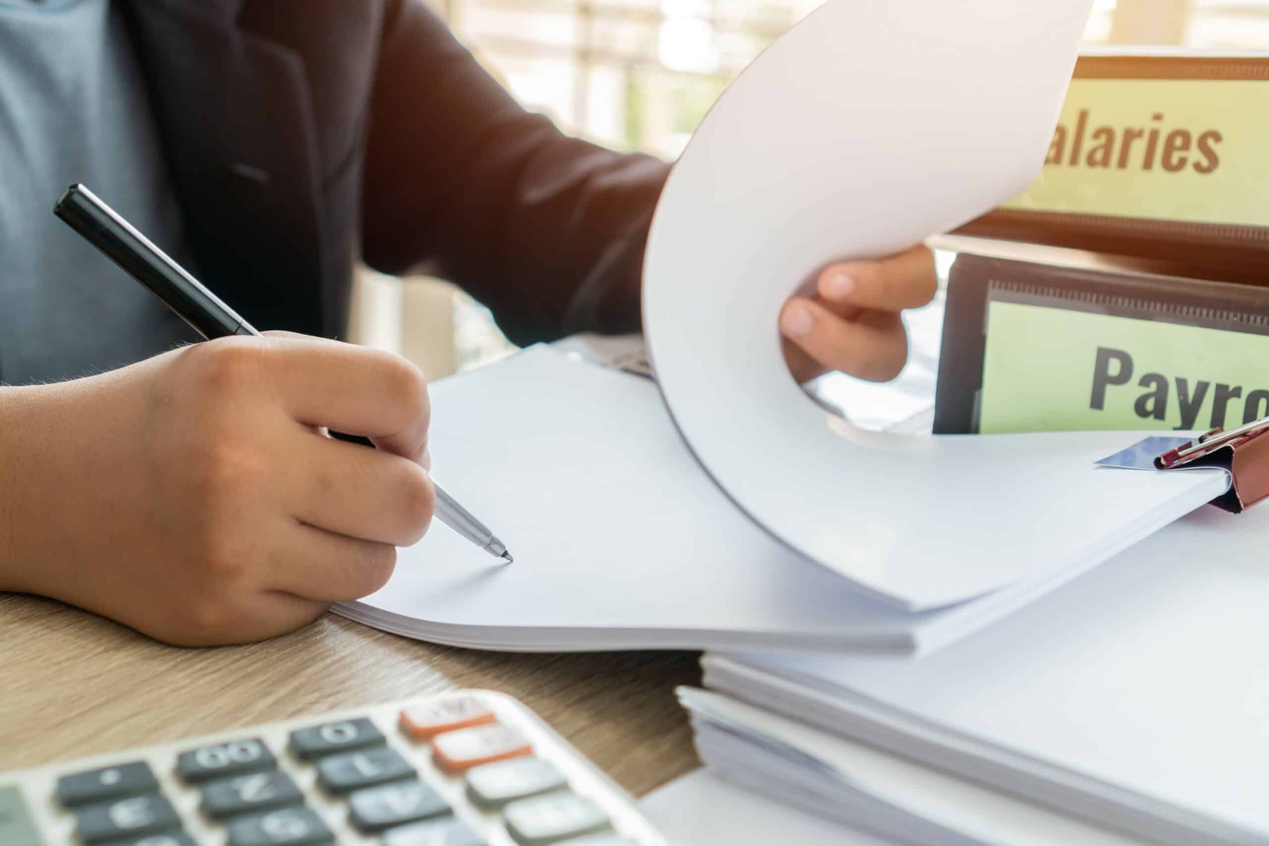 Person making manual calculations.