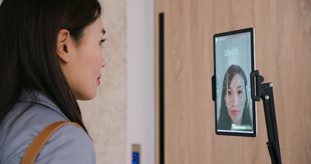 Identity and access management (IAM) system in use by work employee sat at desk