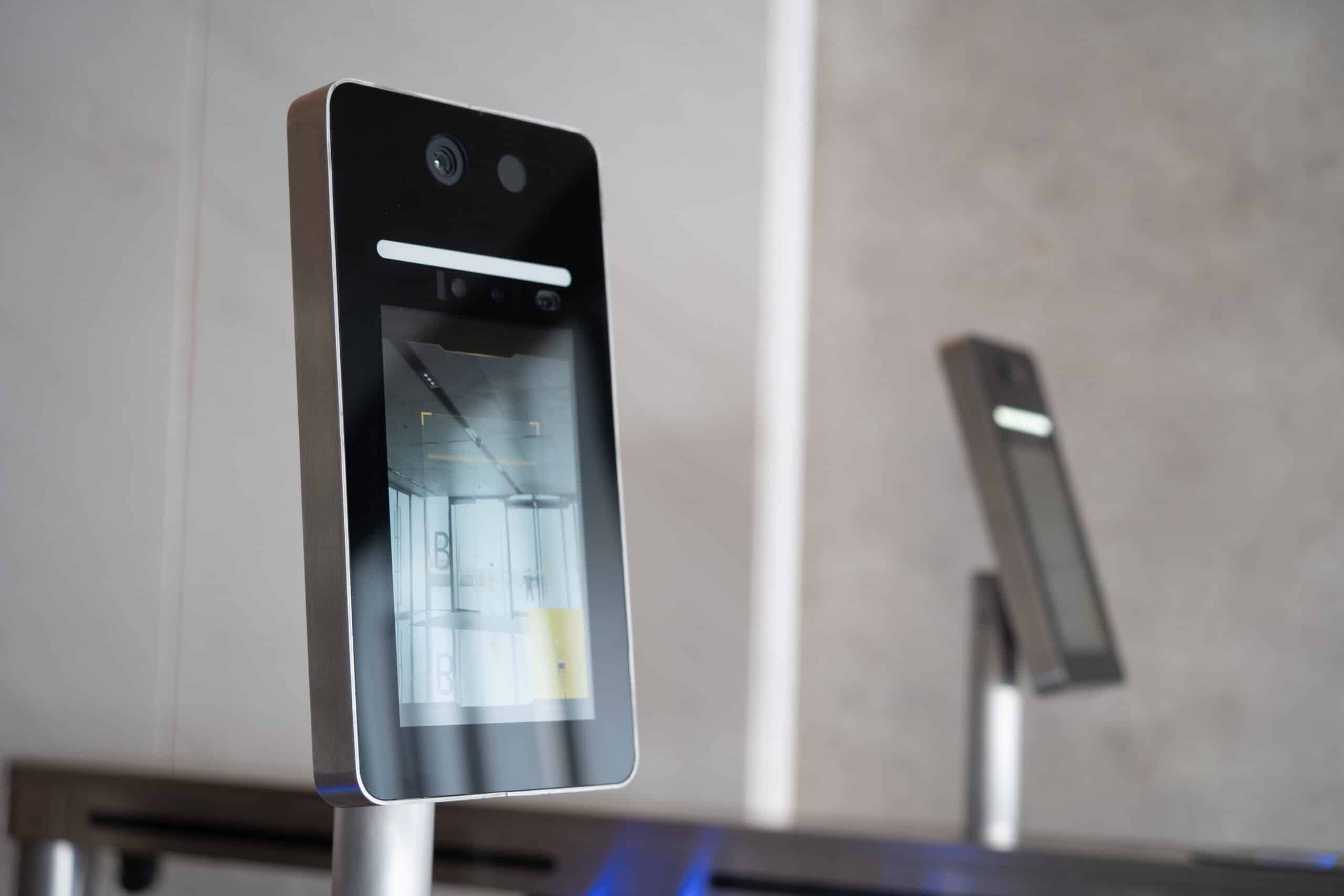 Employee verifying identity on a face recognition access terminal