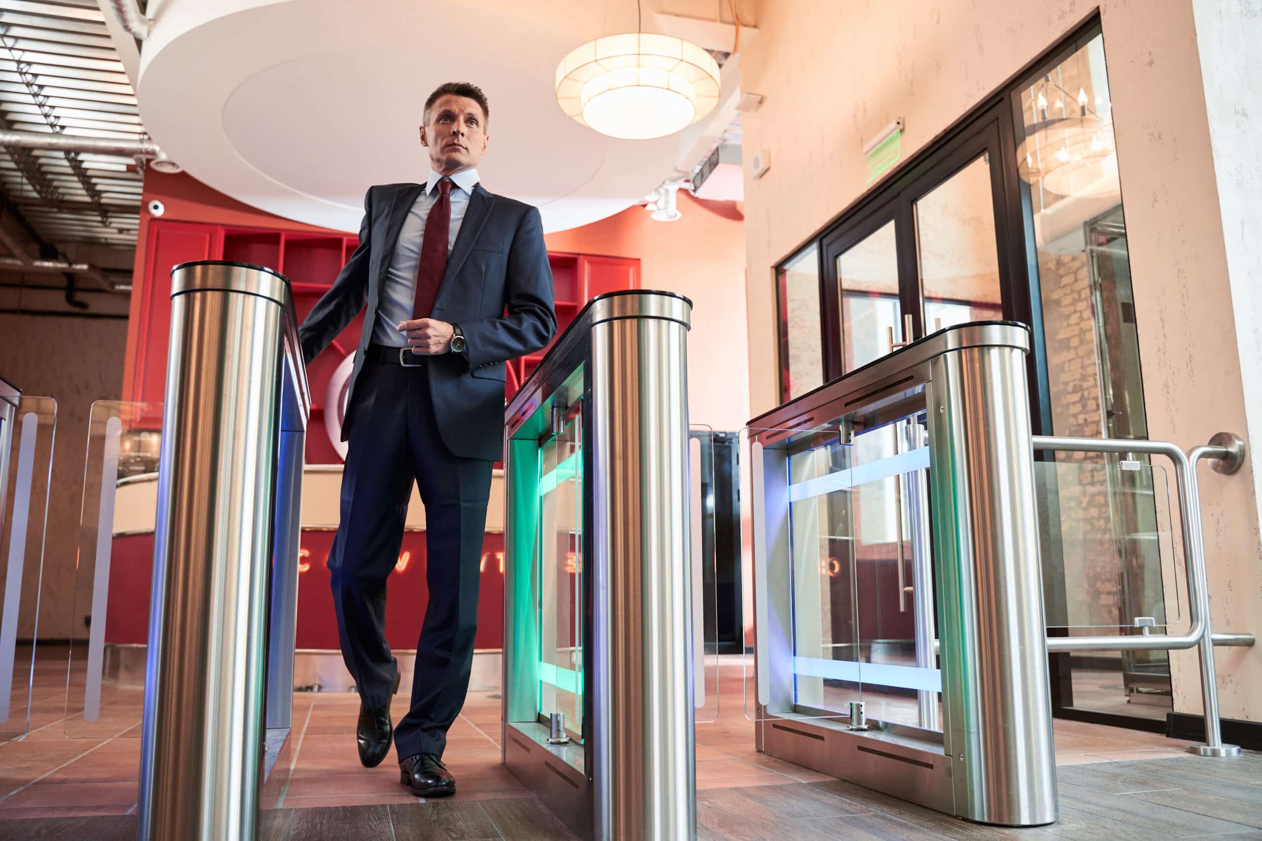 Employee entering the office through an access control turnstile